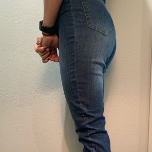 High waisted dark wash jeans.